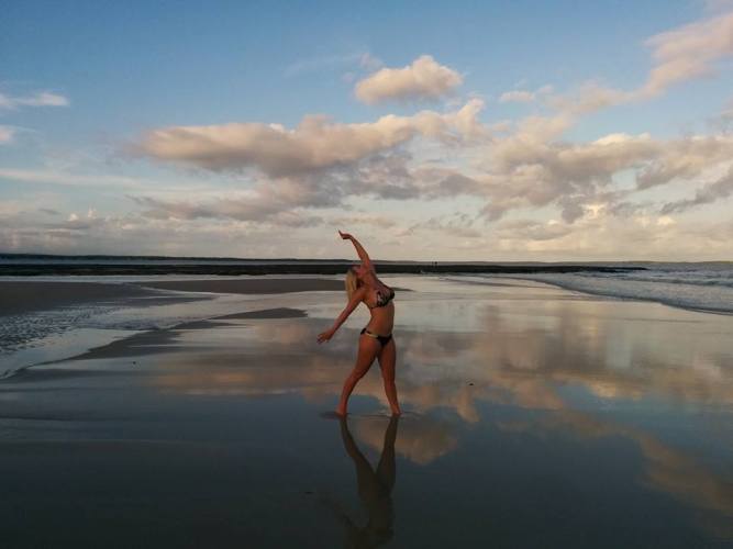 A girl at sunset on the beach