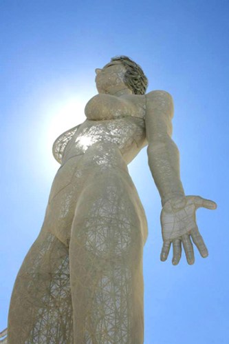 Evolution art sculpture at burning man, a 48 foot tall breathing metal woman