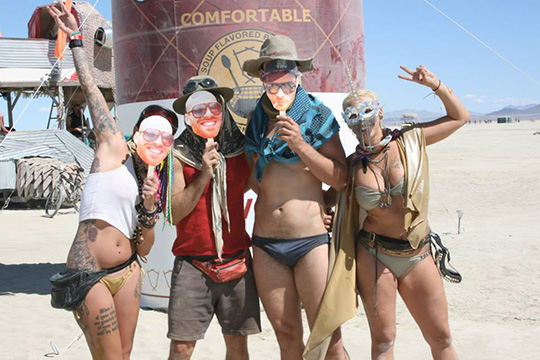 Friends in front of a giant soup can at Burning Man 2015