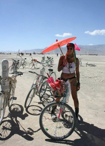 girl with red umbrella at burning man