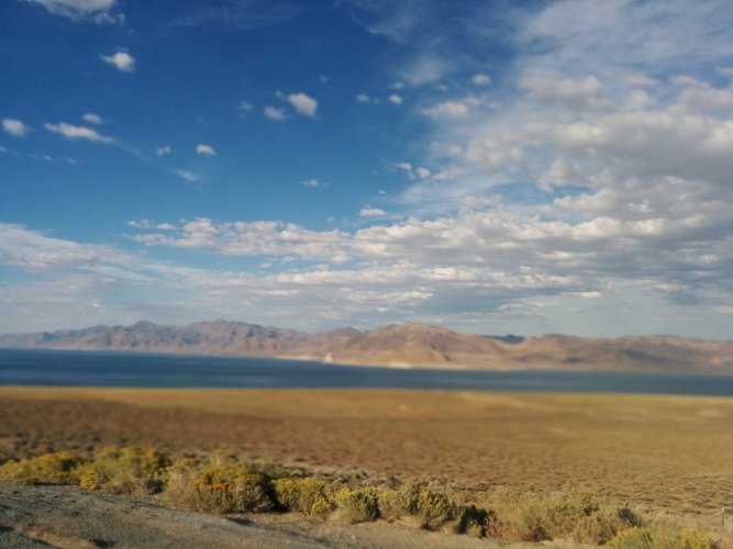 View out the car window of the Nevada desert and Mountain ranges