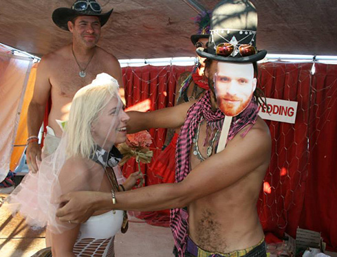 A burner bride is given away at the alter of her Burning Man wedding