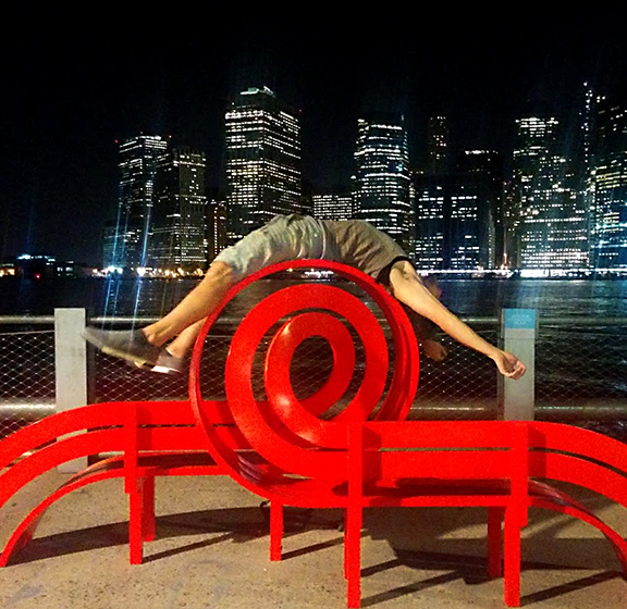man sleeping on art bench in NYC