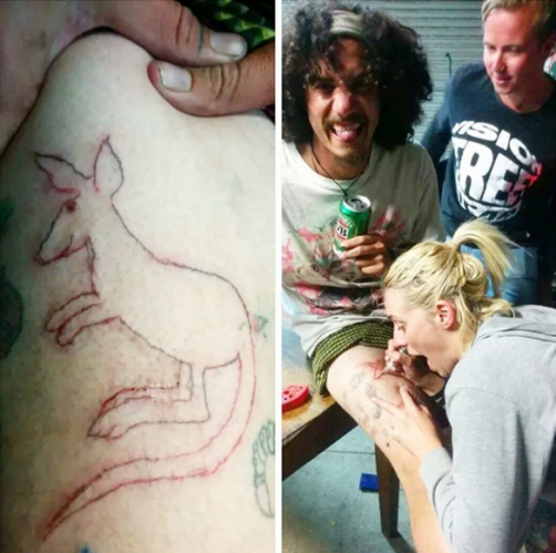Girl tattooing a kangaroo